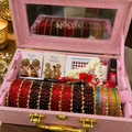 Karwachauth Special Premium Hamper With Name ( 60 diamond bangles + 11 Heavy Ghungroo Bangles + Bindi + Mehndi + Nail Paint + 2 jhumka + Sindur + Lipstick + Gajra + Kajal )